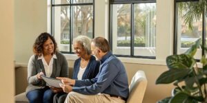 A benefits advisor discussing Medicare dental and vision coverage options with an older Florida couple